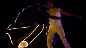 Spinning LED dervish duo exploring themes of seduction and interaction.