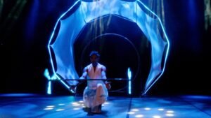 Solo LED dragon staff juggler showcasing precision cinematic light effects.