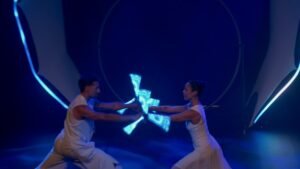 Luminous LED dragon staff duo performing synchronized cinematic choreography.