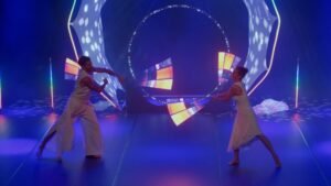 Pixel poi juggling duo displaying high-resolution digital graphics.