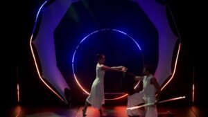 Professional theatrical LED circus production on a contemporary stage in France.